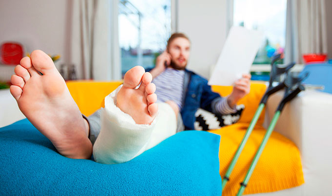 man-with-leg-in-cast-sitting-by-crutches_680x402